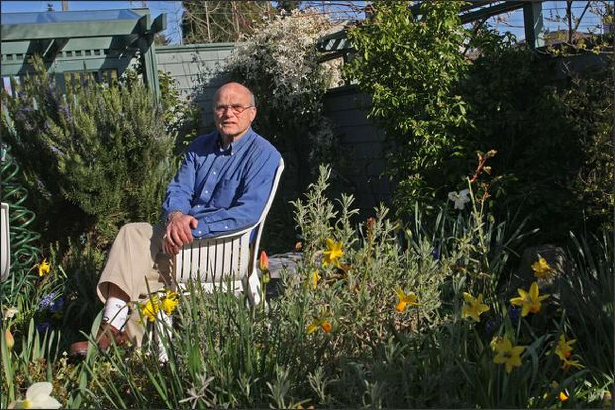 Holocaust survivor Peter Metzelaar sits in his yard in West Seattle. He and his mother hid from the Nazis for more than two years. They first were hidden at an elderly couple's farm in Holland, then fled to apartments in The Hague and Amsterdam.