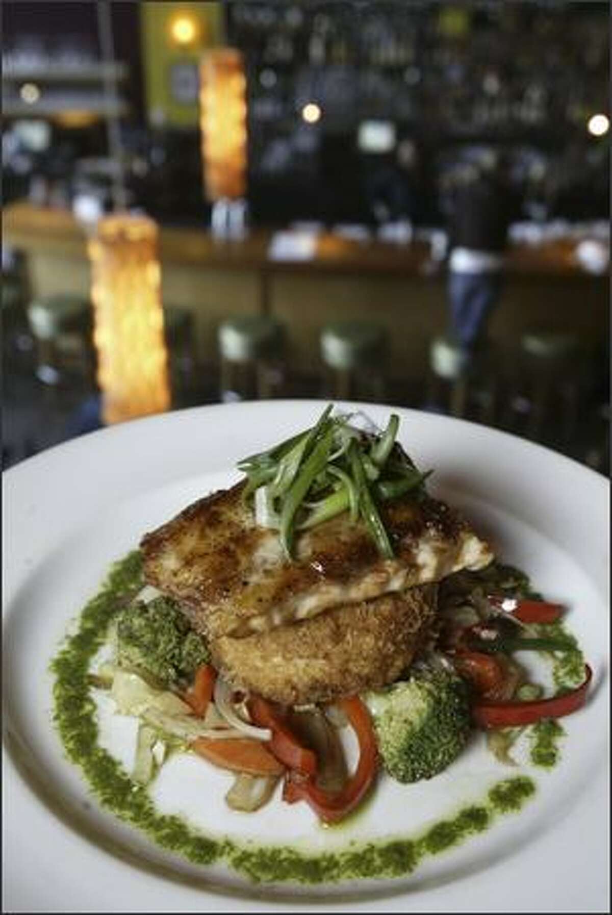 The mouth-watering view of hoisin-glazed mahi with wok vegetables and risotto cake as seen from the loft dining area at Flying Fish.