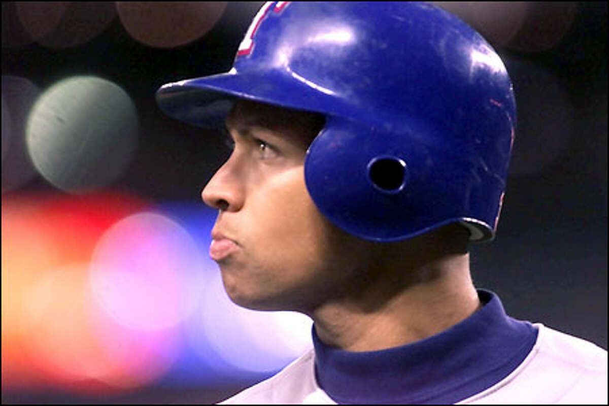 Texas shortstop Alex Rodriguez frowns after striking out in the fourth inning against the Mariners at Safeco Field.