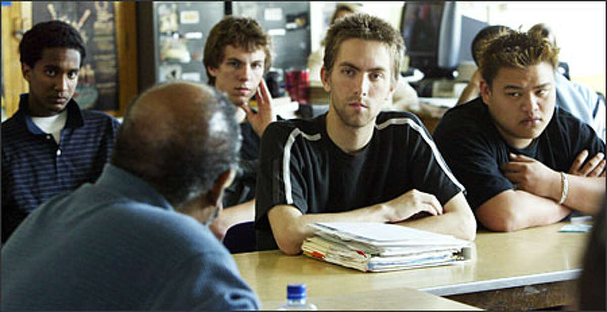 Garfield High students, from left, Meseker Weldemichael, Isaac Spiel, Ross Coyne and Tan Nguyen listen intently as Jones responds to questions, which ranged far and wide, from a group of 25 juniors and seniors last Wednesday. "It was always for me about the characters," Jones imparts at one point, "and the good and bad things they do to each other."