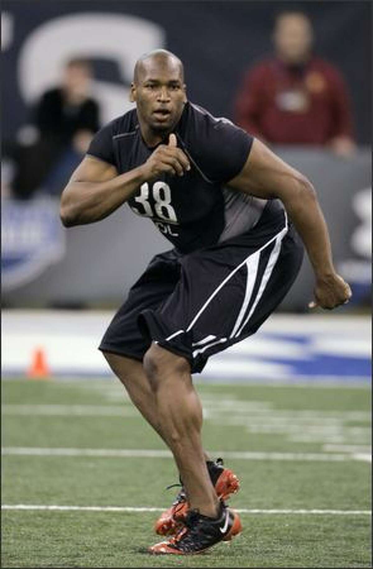 In this Feb. 21, 2009 file photo, Virginia offensive lineman Eugene Monroe runs a drill at the NFL Scouting Combine in Indianapolis. Monroe is a top prospect in the 2009 NFL Draft. (AP Photo/Darron Cummings, File)