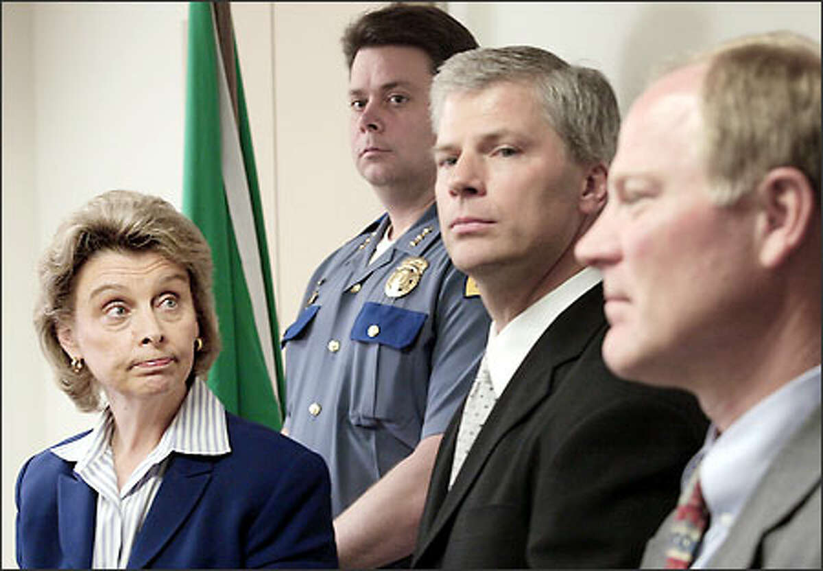 Christine Gregoire, from left, State Patrol Chief Ronal Serpas, U.S. Attorney John McKay and FBI Special Agent in Charge Charlie Mandigo announce the inquiry.