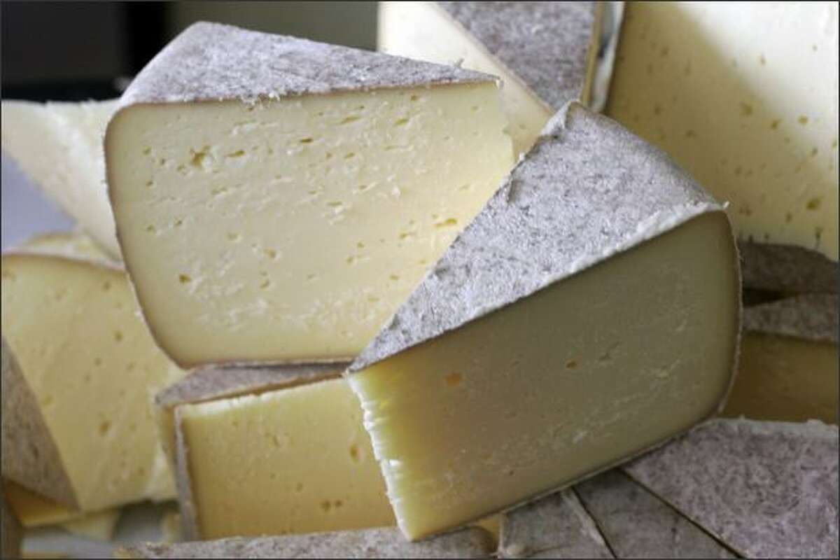 Mount Townsend Creamery's Trailhead Tomme is a rustic, medium-hard whole milk cheese made by hand in 6-pound wheels. It is pressed and brined then washed in salt water and yeasts for two months. It develops a distinctive natural mold rind and its full nutty flavor by four months. At six months it becomes drier.