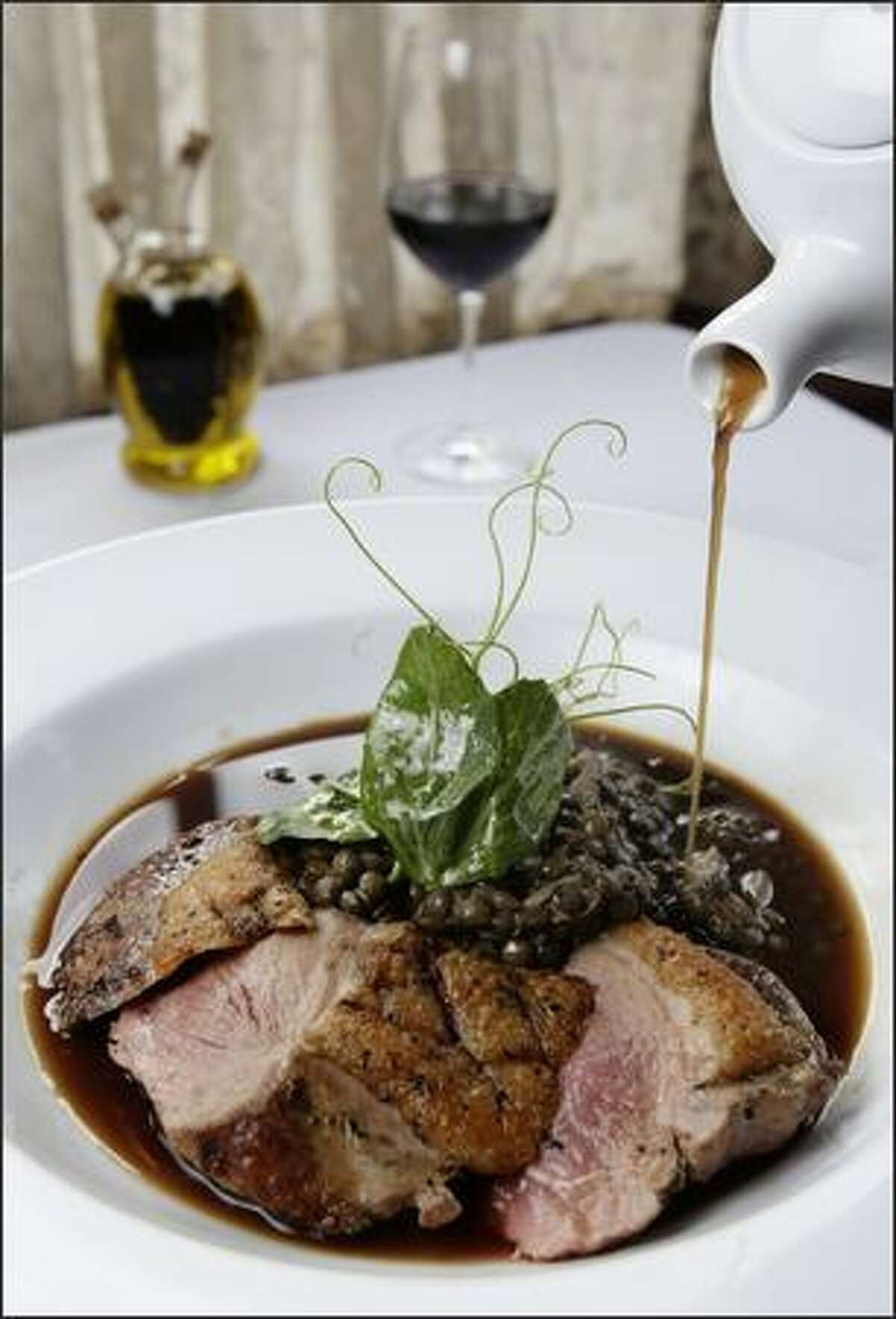 Ripasso duck jus is poured over Anatra Alla Lenticchia, a seared duck breast with lentils, pancetta, duck confit and pea vines. La Dolce Vita's menu is worthy of special occasions, arranged traditionally into starters, pasta and entrees.