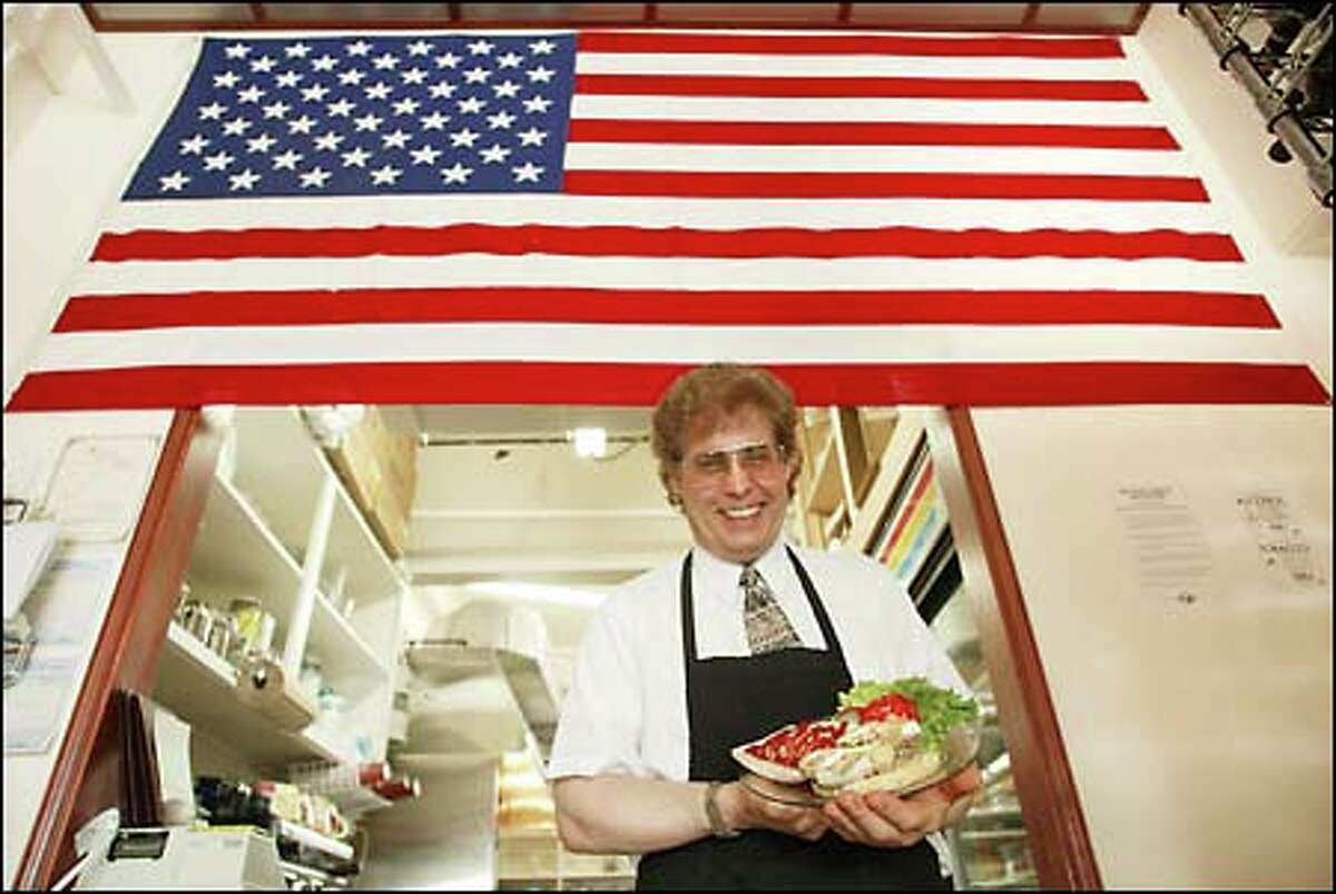 Sterling Cafe owner/chef Don Wilson works his wonder with all-natural meats and organic fare. He opened the eatery on Sept. 11, hence the massive American flag.