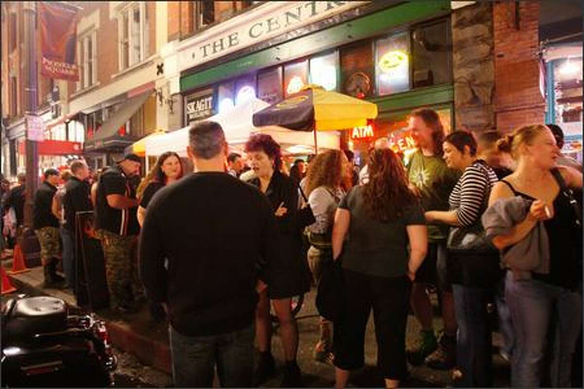 At 11:30 one night in Pioneer Square, by The Central and J & M Cafe, people wait for a cab, wait to get into clubs, wait to meet friends while having a smoke -- mild compared with some of what goes on.