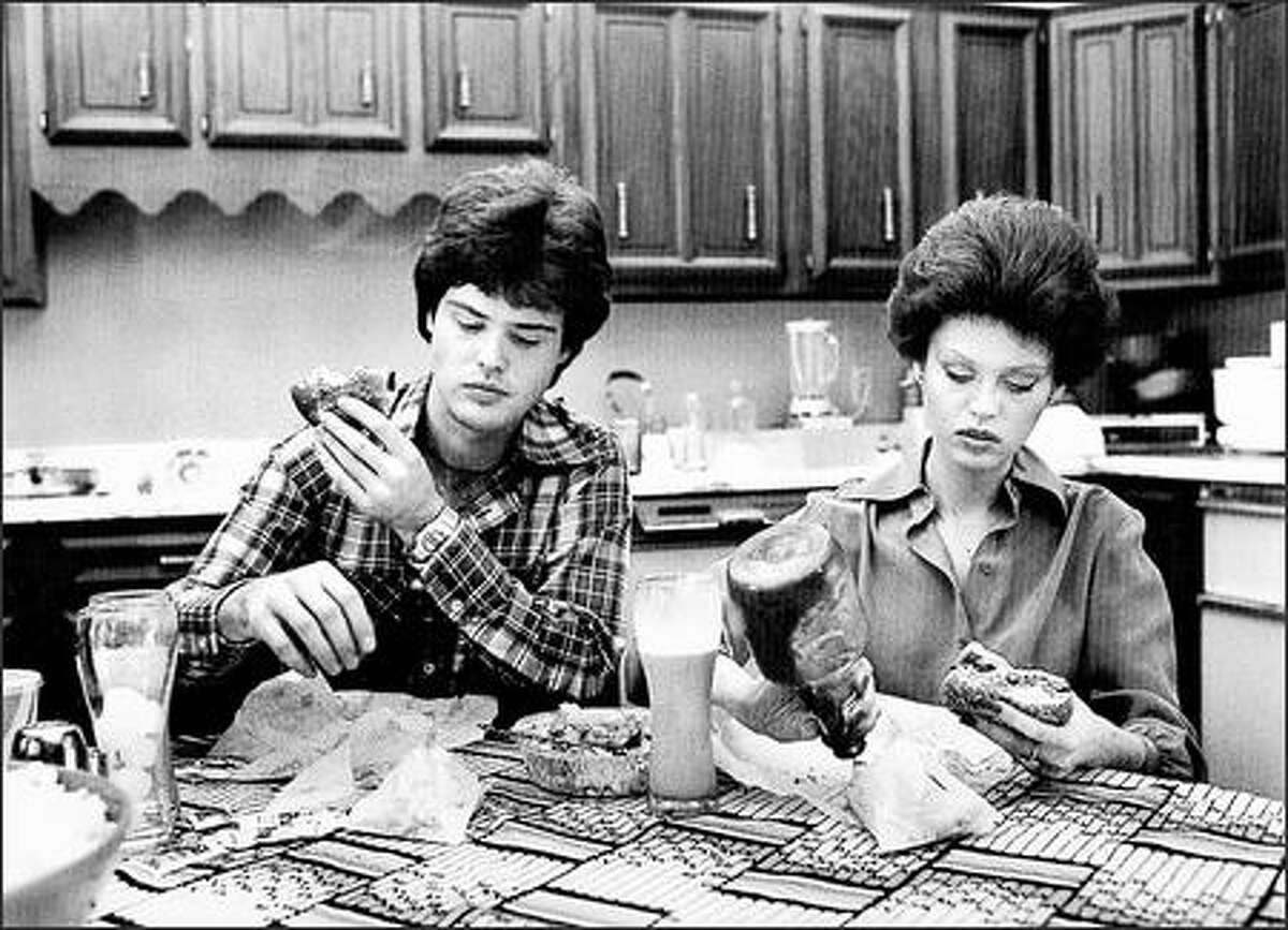 Food is not a pleasure at the Osmond home in 1972. The brother/sister pop stars Donny and Marie were so comfortable with the photographer they didn't bother to impress him.