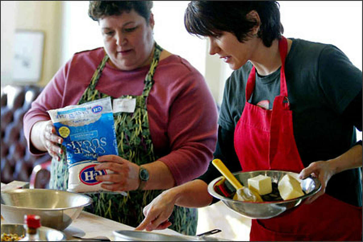 D. Parvaz, right, and Becky Hart team up on a recipe. Now that she's a cooking-school graduate, Parvaz cooks for herself a few nights a week.