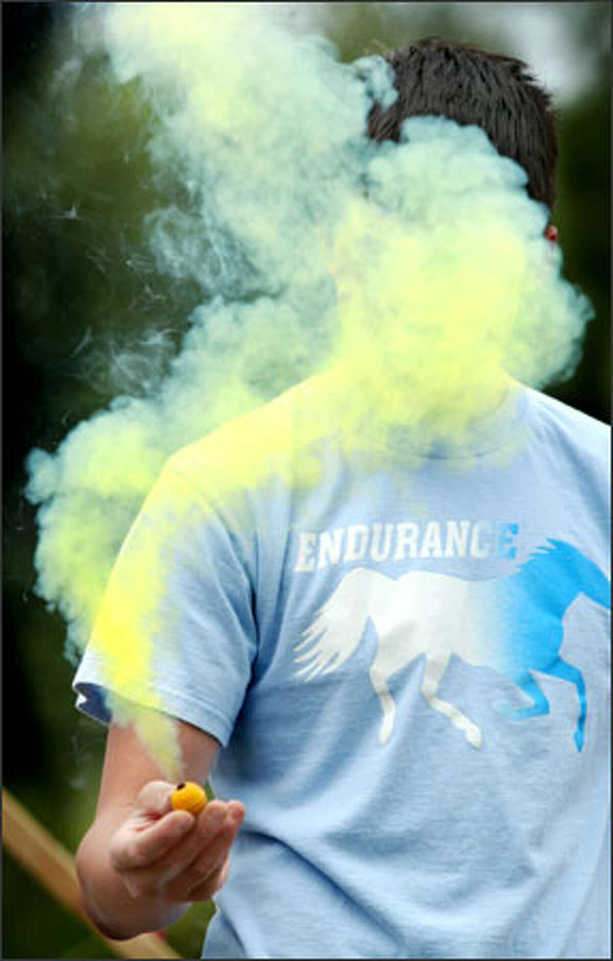 This is no smoke screen: David Montano tests a smoke bomb at Boom City, the Tulalip Tribes' fireworks emporium. Montano and his friends were shopping yesterday for fireworks for the Fourth of July.