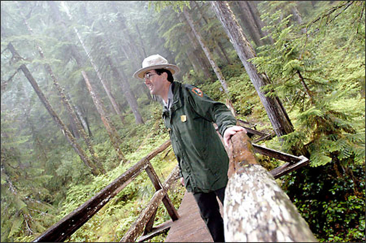 Dave Uberuaga, superintendent of Mount Rainier National Park, walks on a bridge in need of renovation at the park. Mount Rainier National Park is the nation's fifth-oldest national park, hosting about 2 million visitors a year. Uberuaga is worried about keeping it in shape for the guests.