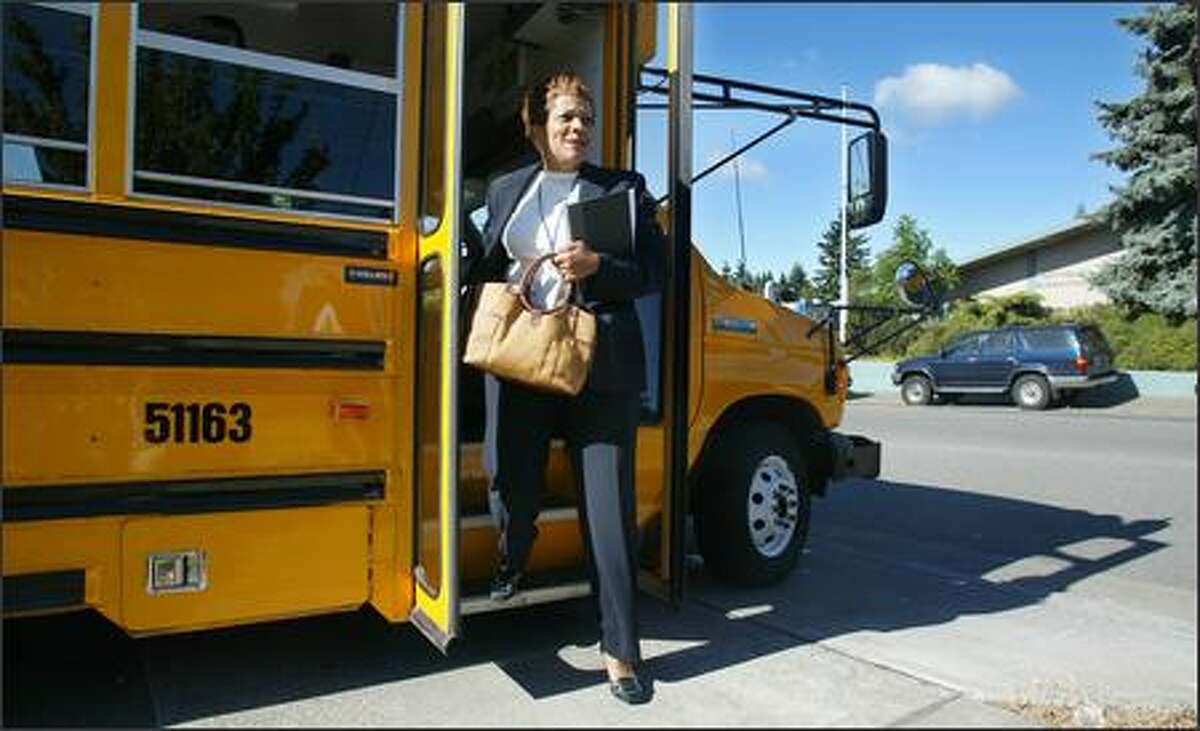Schools superintendent Maria Goodloe-Johnson steps off the bus Monday at Northgate Elementary, her first tour stop. The tours were the first step in developing a comprehensive plan for Seattle schools.