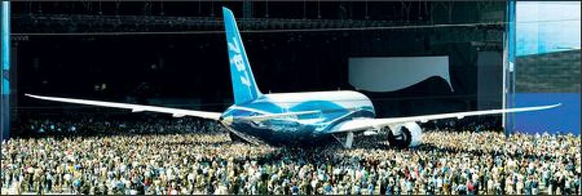 Boeing workers admire the 787 Dreamliner during its debut Sunday in Everett. A lot of work remains to get the new jet off the ground, including the installation of many systems that weren't on board Sunday. (Charles Conklin photo)