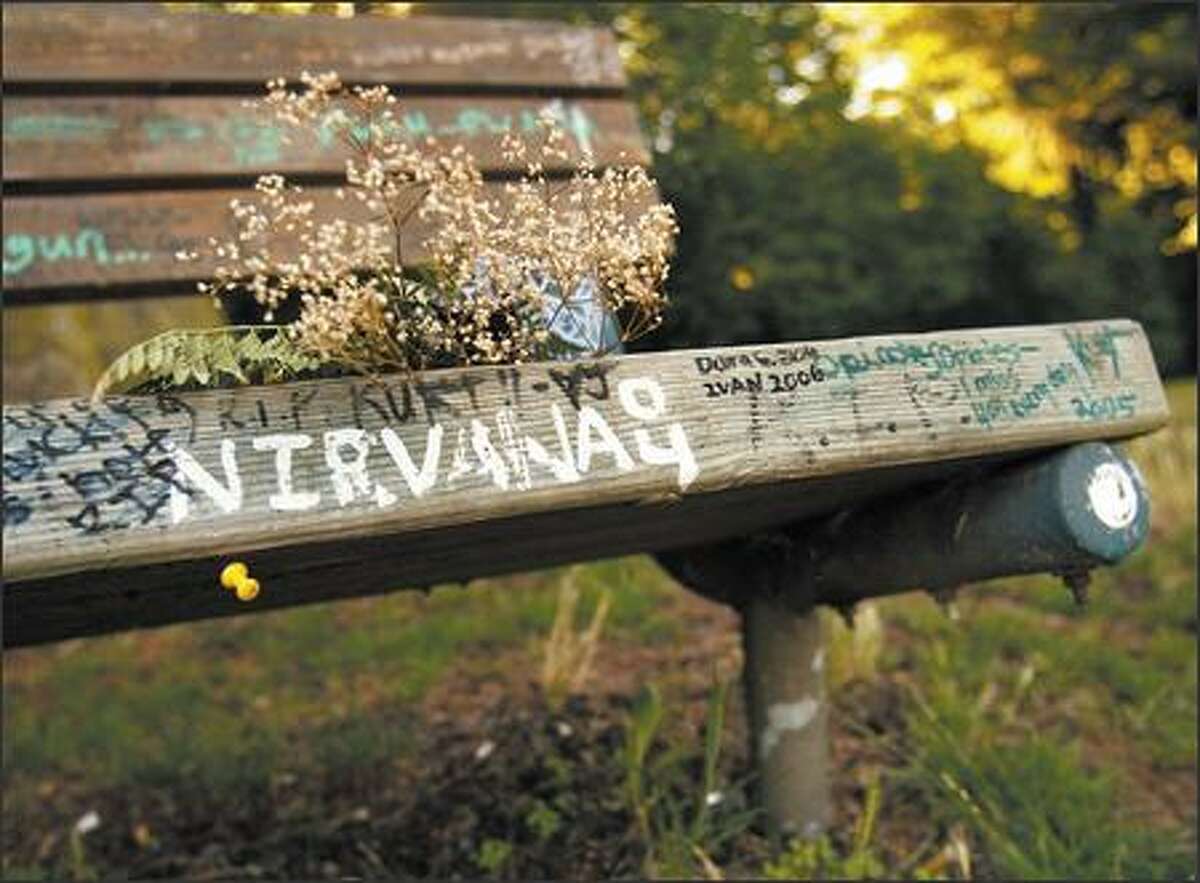 The Sub-Seattle Tour passes a bench next to the Madrona area home where Kurt Cobain committed suicide in 1994.