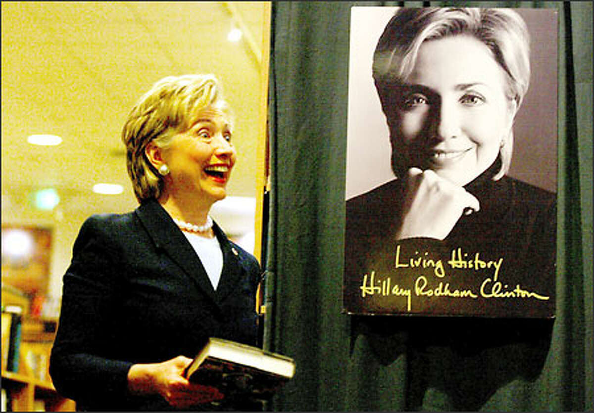 Hillary Rodham Clinton arrives at a well-attended book signing yesterday at Third Place Books in Lake Forest Park.