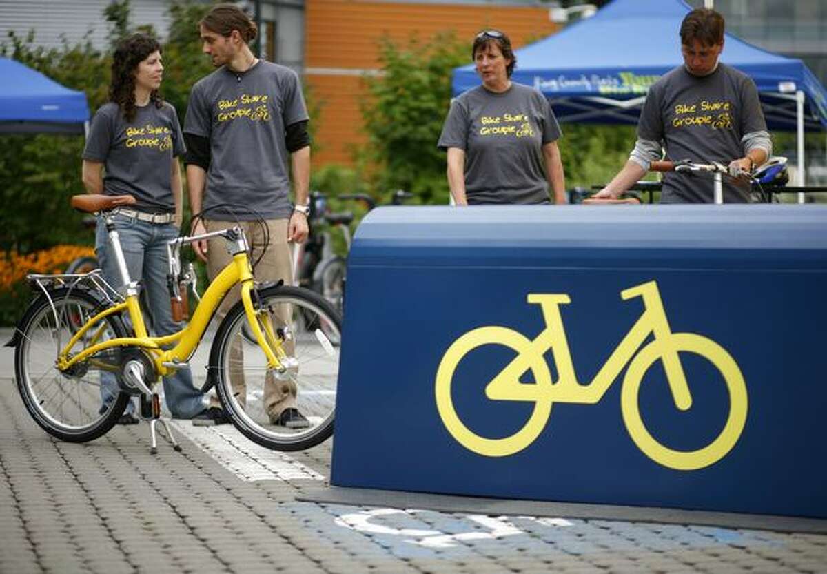 Members of the Bike Share Group show one of their share bikes during a demonstration at the South Lake Union Discovery Center in Seattle.