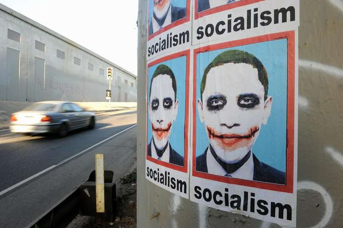 A poster portraying President Barack Obama as "The Joker" from the Batman movie "The Dark Knight" is visible on a highway pillar in Los Angeles on Aug. 7.