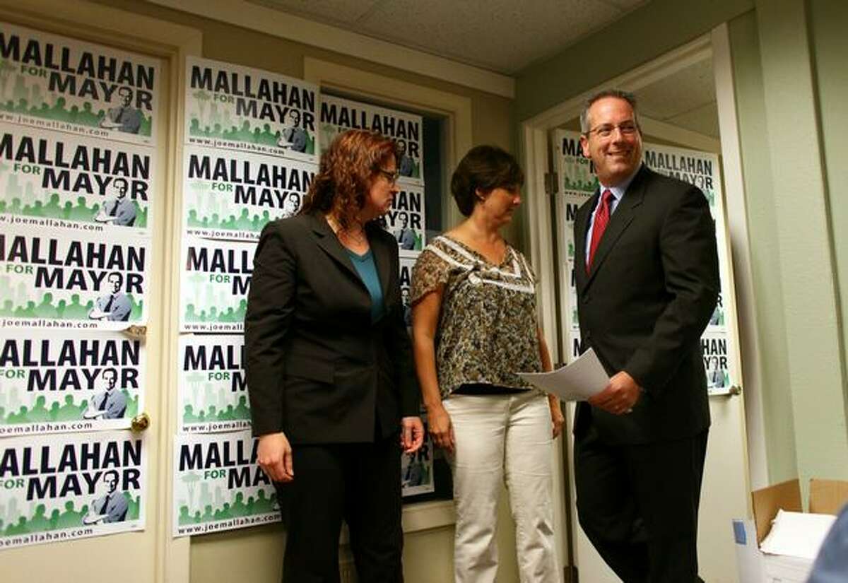 Seattle mayoral candidate Joe Mallahan walks into a room to speak to the news media in his Eastlake neighborhood campaign office after Mayor Greg Nickels conceded the primary election.