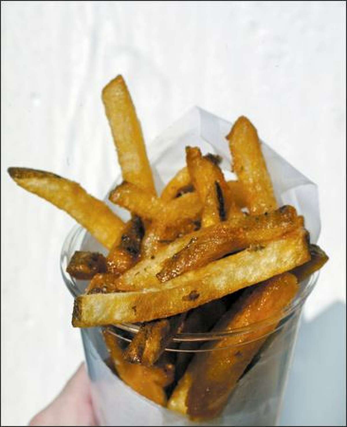 Some successful chefs are turning their talents to less formal side ventures, such as Monsoon chef Eric Banh's Baguette Box, where these truffle fries are served.