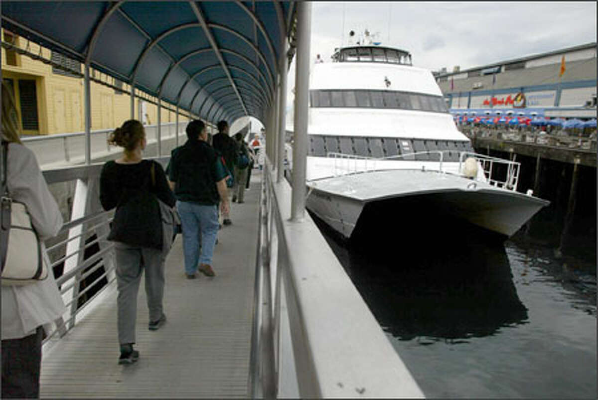 The Kitsap Ferry Co. offers passenger-only service between Seattle and Bremerton. Here, passengers board the Spirit of Adventure recently at Seattle's Pier 56.