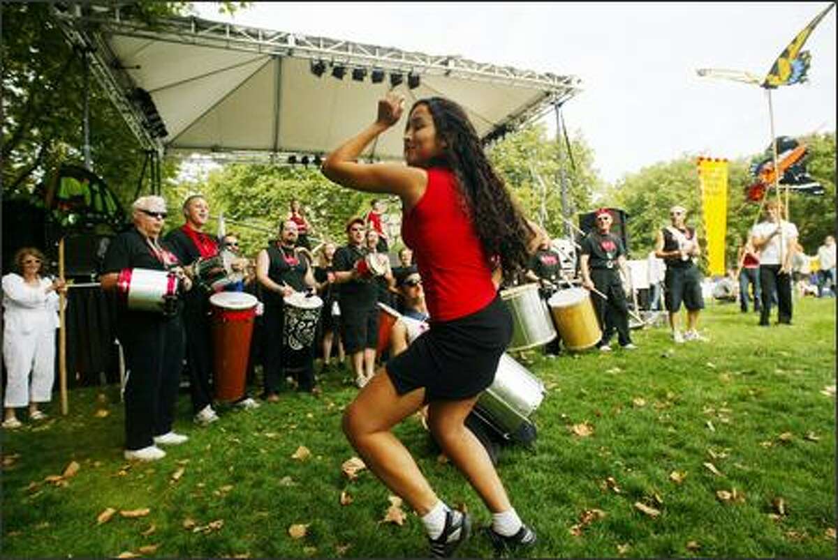 Vanessa Miranda of Vamola! Drum and Dance Ensemble entertains the crowd before the group paraded through the crowd.
