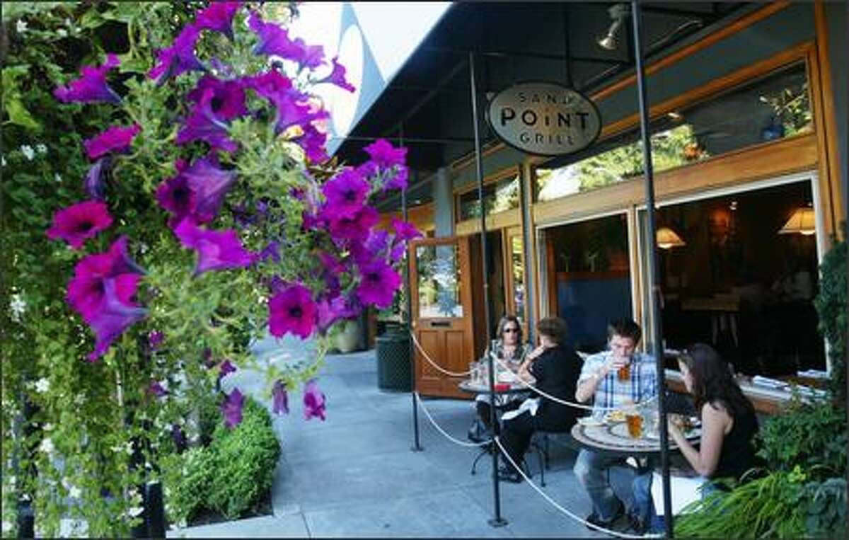 Patrons enjoy their meals and the weather in the outside dining area of the Sand Point Grill in Seattle. A new executive chef, Charlie Durham, has restored the luster of the 7-year-old neighborhood restaurant.