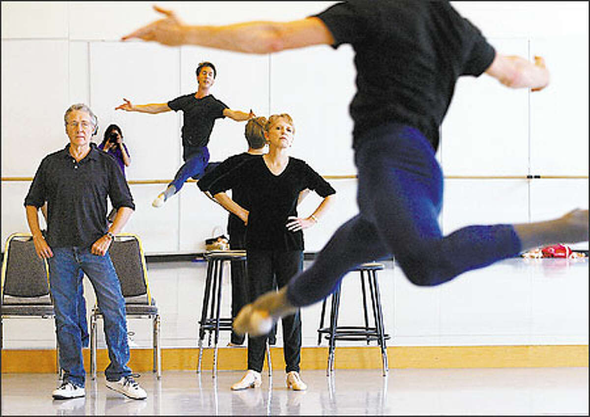 Pacific Northwest Ballet co-artistic directors Kent Stowell and Francia Russell observe dancer Jeffrey Stanton during a rehearsal for "Swan Lake."