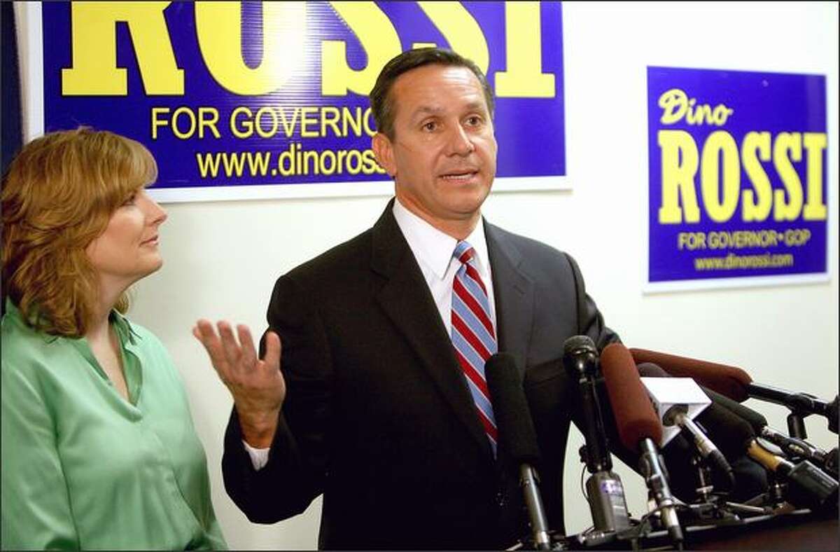 Republican gubernatorial candidate Dino Rossi, with his wife, Terry, by his side, makes his concession speech in the governor's race with Christine Gregoire at his Redmond, Wash., campaign headquarters on Wednesday. He has since returned twice to fill vacancies in the State Senate.