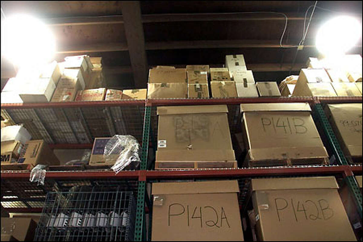 Hundreds of Green River Killer evidence boxes line the top shelf of a pallet rack at the King County Sheriff's storage facility in South Seattle.