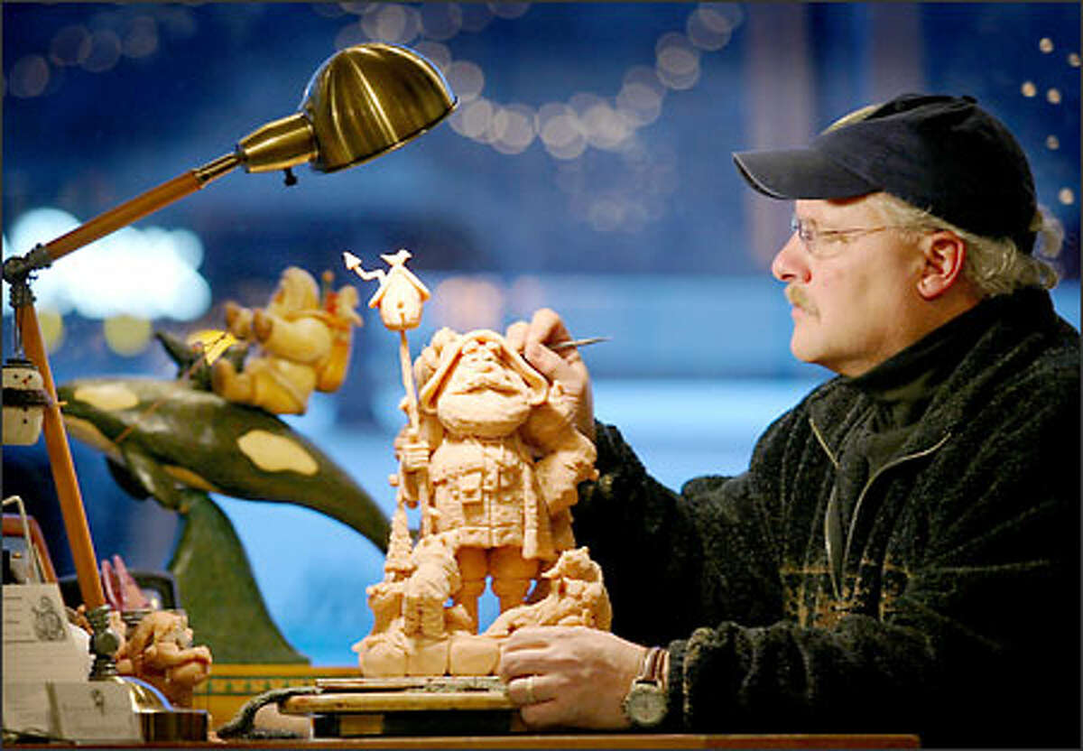 Dennis Brown is part of the window display at his Kirkland shop, where he sits at a workbench carving Santas out of polymer. Reasons to Believe is filled with thousands of Santas, which range from traditional to offbeat.