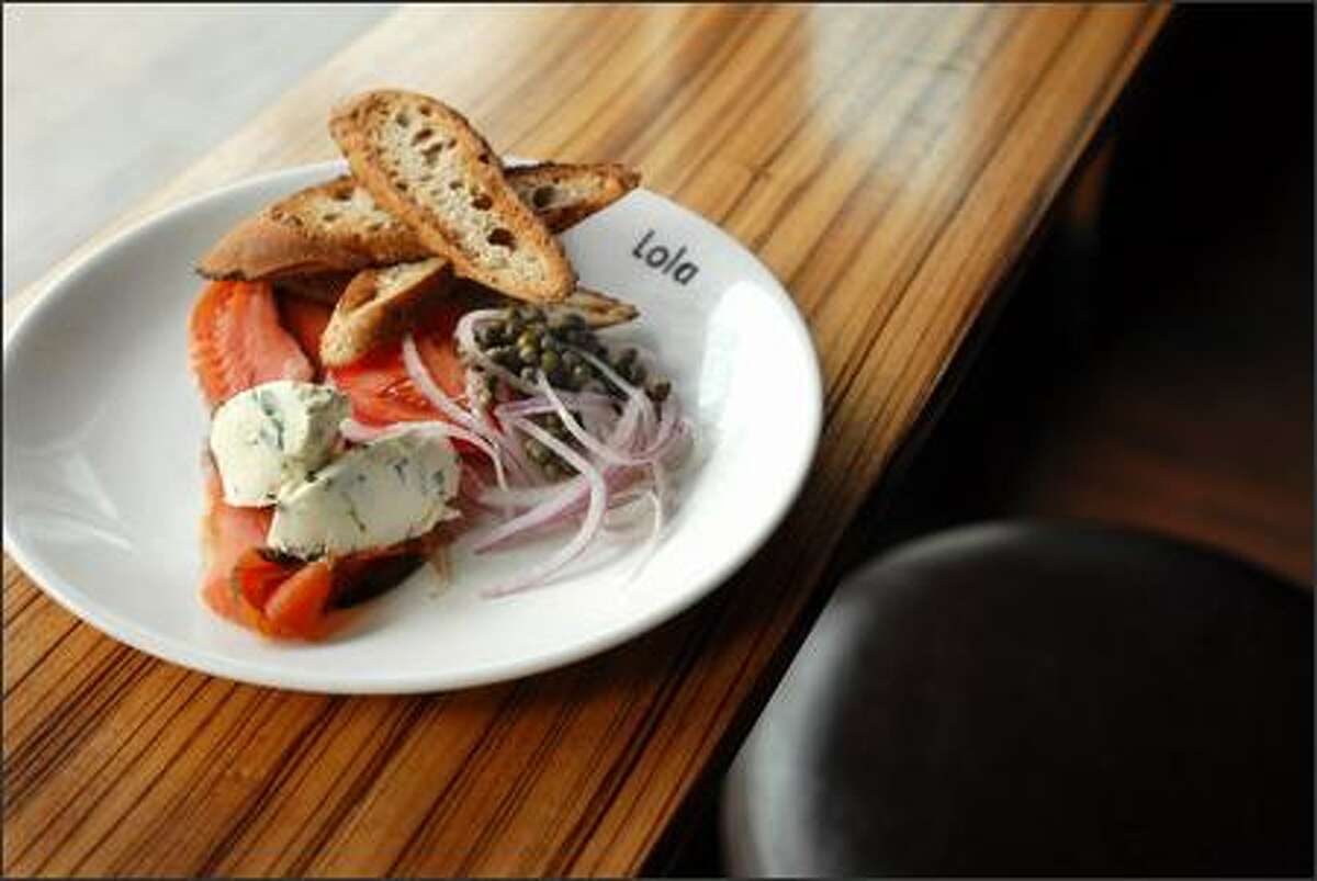 Lola's offers a plate of house-cured gravlax with capers, chive cream cheese, and ficelle.