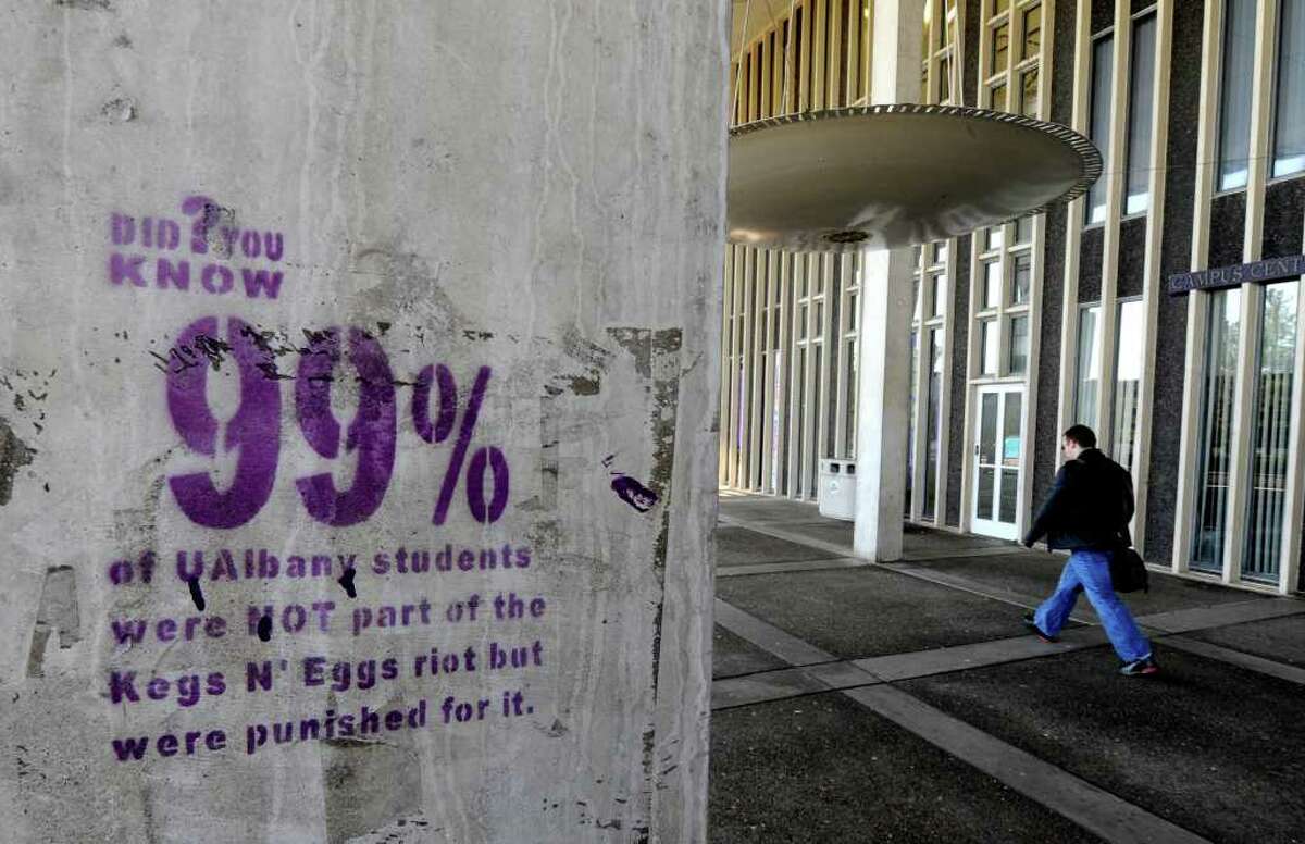A large number of columns on the main level of Academic Podium of the University at Albany, N.Y. were stenciled with an inscription stating that 99% of the student body was not responsible for the Kegs and Eggs riots overnight and was discovered this morning April 6, 2011. (Skip Dickstein / Times Union)