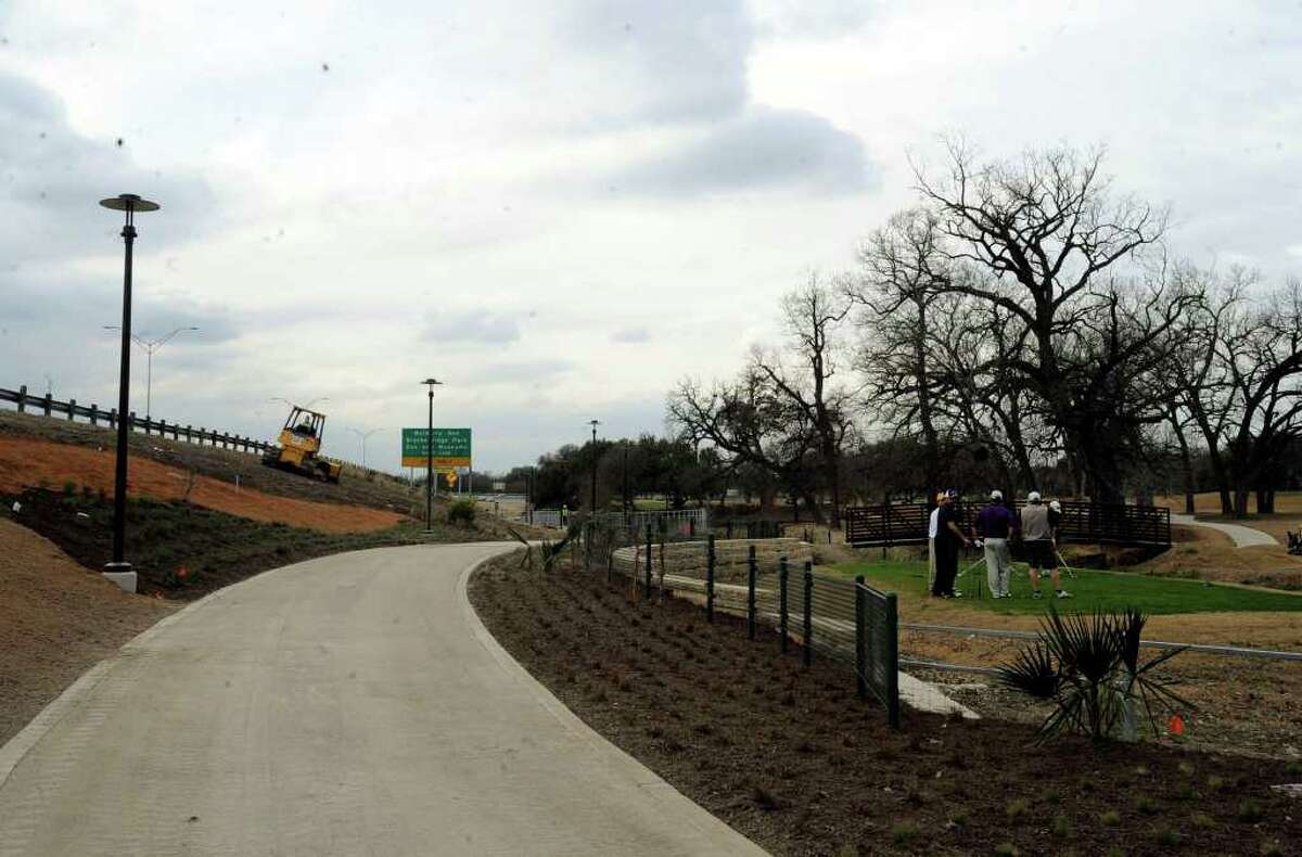 A new lighted 10-foot-wide path that cost $3.7 million takes walkers and bicyclists from the Pearl Brewery to the edge of Brackenridge Park Golf Course.