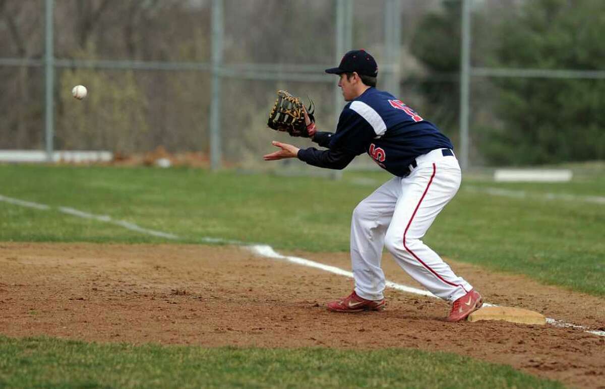 McMahon's Aleko Petridis makes a catch at first base during Wednesday's game at Brien McMahon High School on April 6, 2011.