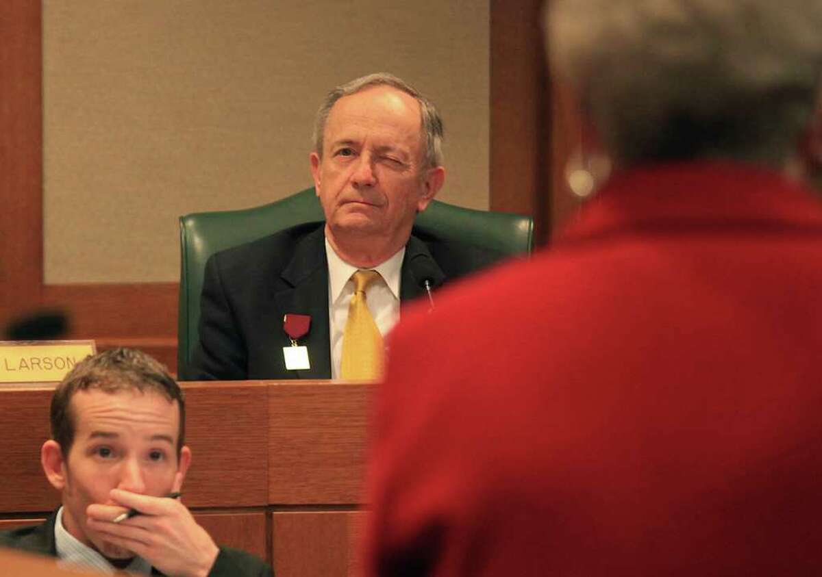 State Senator Jeff Wentworth winks at Karen Thompson (far right), Historian General of the Daughters of the Republic of Texas, after clarifying something she said. The Daughters and others testify on bills relating to the preservation and maintenance of the Alamo in front of the House Committee on Culture, Recreation and Tourism in the Capital Extension in Austin on April 6.  