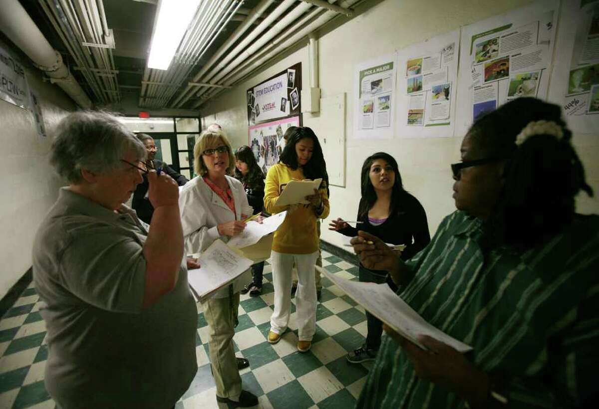 Welcome Walk Committee members assess the condition and appearance of the facility during a walking tour of Bassick High School in Bridgeport on Thursday, April 7, 2011. From left are science teacher and facilitator for the facilities cadre Donna Koolis, school nurse Janet McHugh, sophomore Yoleto Torres, 15, junior Nikky Ramos, 17, and parent Rosemarie Brown.