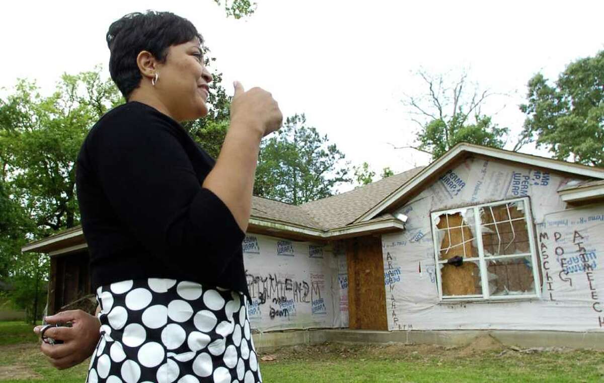 Legacy Community Development Corp. has begun a redevelopment push in the city's North End (and South End) with generous city commitment. Executive director Vivian Ballou talks about one of the homes her group will refurbish and resell at 4455 Woodlawn in Beaumont. This home was under construction before Hurricane Rita when the bank foreclosed on it. Legacy CDC will finish construction and get a homeowner into it some time in late August. Dave Ryan/The Enterprise