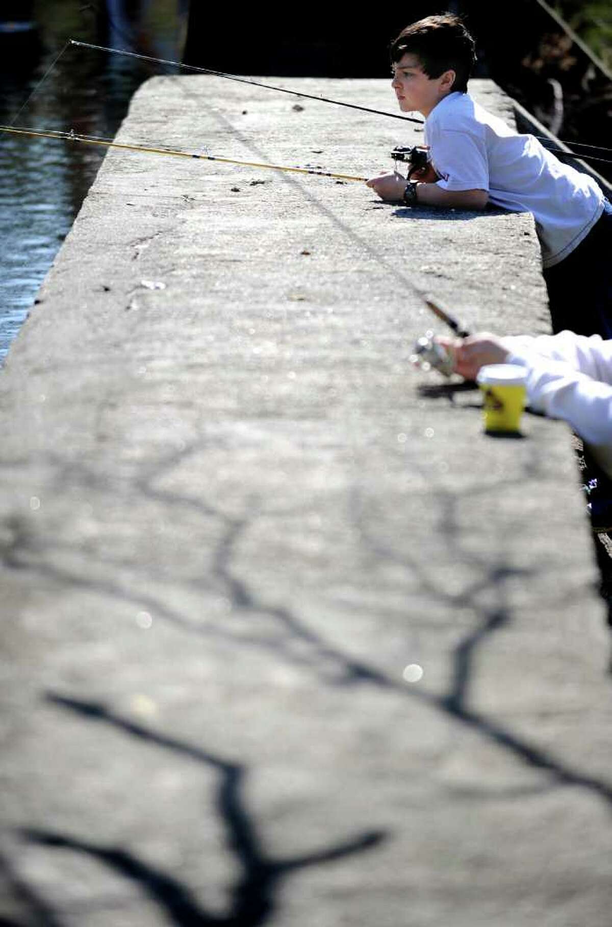 Ten-year-old Clayton McGoldrick, of Southport, waits for a bite Saturday, April 9, 2011 during the annual PAL fishing derby at Gould Manor Park in Fairfield, Conn.