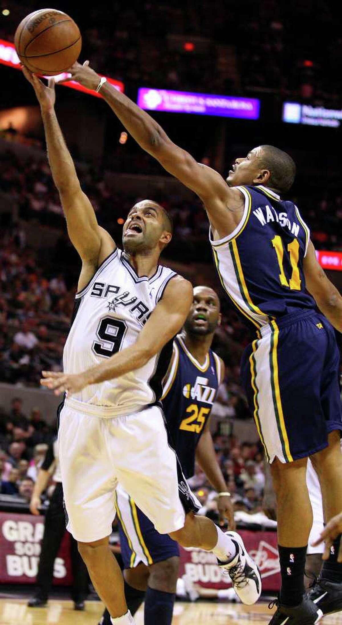 Spurs' Tony Parker shoots around Jazz's Earl Watson during second half action Saturday April 9, 2011 at the AT&T Center. The Spurs won 111-102. (PHOTO BY EDWARD A. ORNELAS/eaornelas@express-news.net)