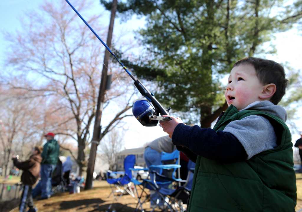 a 6-year-old boy with a fishing rod - Playground