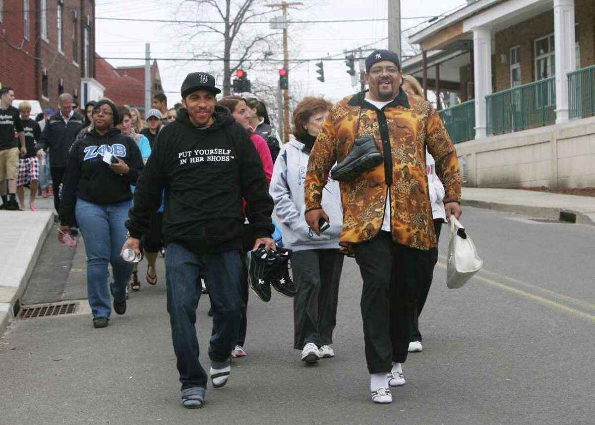 Barry Evans, left, and John Morangello, both of New Haven, walk in the 5th Annual "Walk a Mile in Her Shoes" event, sponsored by The Milford Rape Crisis Center, in Milford on Sunday, April 10, 2011.