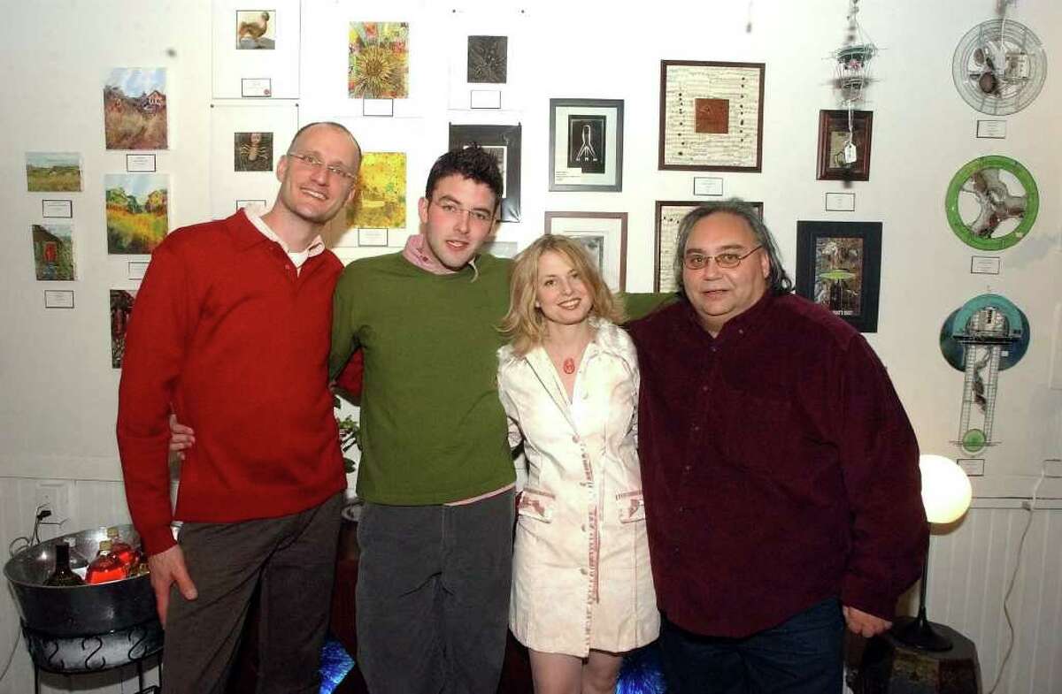 The staff of Trink Sense Sational Furnishing & The CJ Gallery-.(L. to R.)-George Pisegua and Justin Hoin of Surface Design. Nadia Trinkala, owner of Trink Sense-Sational Furnishings. Tom D'Ambrose of C.J. Gallery. Times Union archive