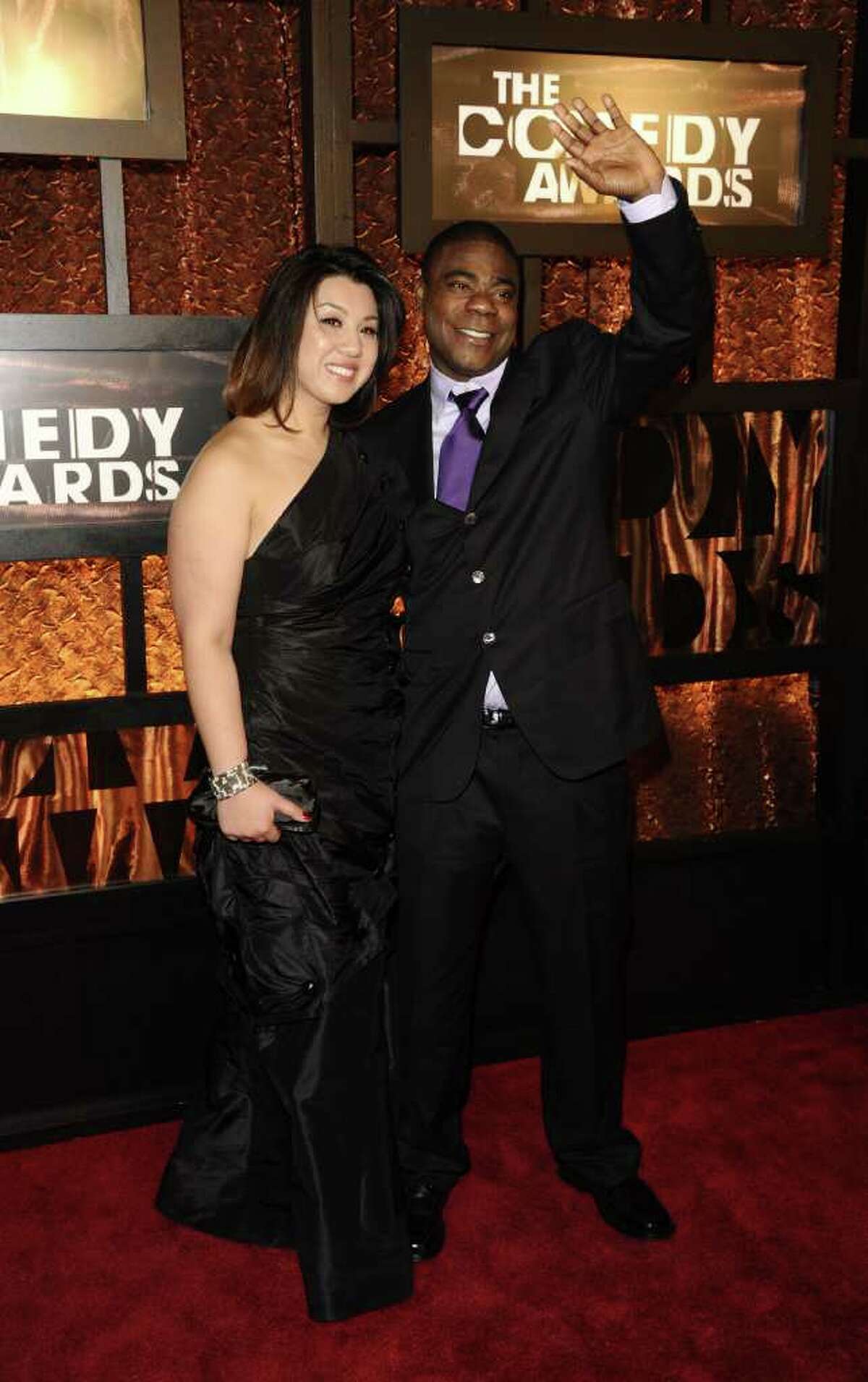 Actor Tracy Morgan, right, and his date Linda Trang attend the first annual "The Comedy Awards", honoring and celebrating the world of comedy, in New York, on Saturday, March 26, 2011.