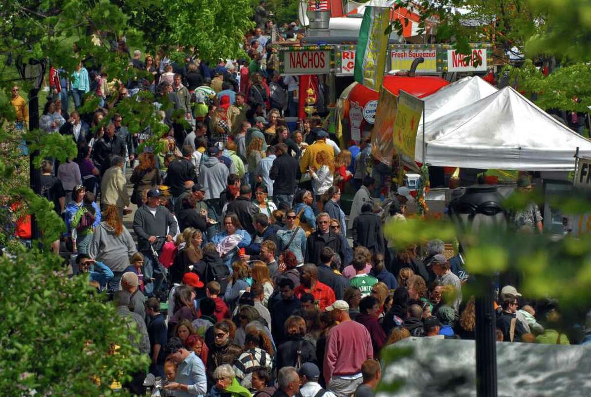 Large crowds file past food vendors during the annual Albany Tulip Festival in Washington Park in Albany, NY Sunday May 10, 2009. (Philip Kamrass / Times Union)