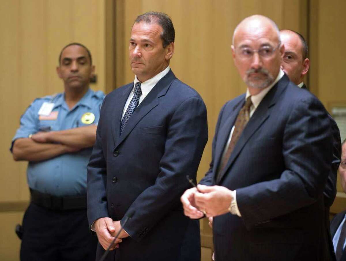 In this July 28 file photo, Shoreline Pools President David Lionetti stands with his attorney Richard Meehan right during an arraignment in Stamford Superior Court on second-degree manslaughter charges in connection with the death of a 6-year-old Greenwich boy who drowned after his arm was trapped in a suction drain. (AP Photo/Douglas Healey)