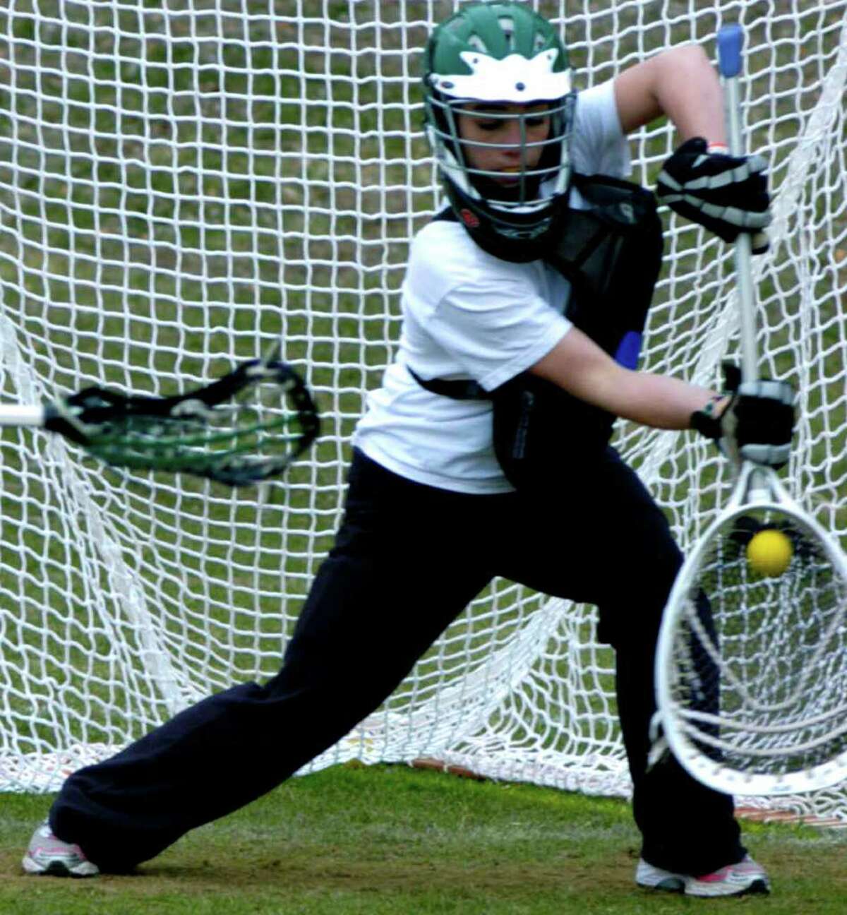SPECTRUM/Goaltender Kate Leier works on her craft in practice for New Milford High School girls' lacrosse, April 2011