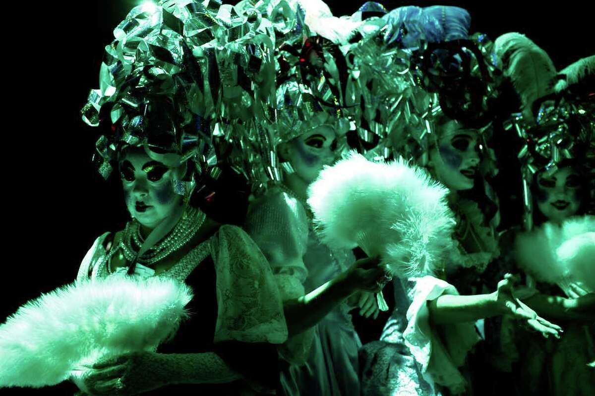 Terri Upton, left, waits with her fellow "Consorts To The King" to perform the opening scene, The Order of the A-Corn "Arrival of King Anchovy XLVI," Ruler and Sovereign Head of Cornyation 2011, during Cornyation, The Court of Double-Dip Shellacking, at the Charline McCombs Empire Theatre on Tuesday, April 12, 2011.