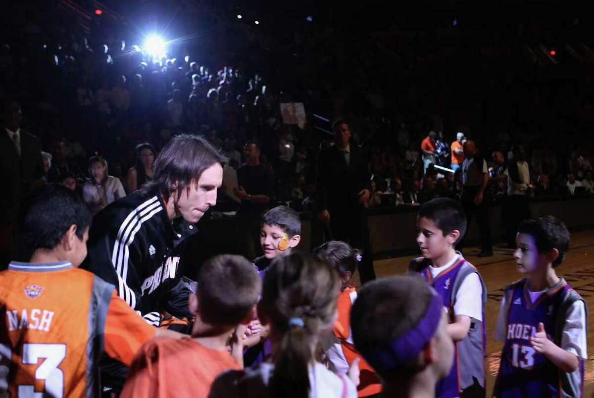 PHOENIX, AZ - APRIL 13: Steve Nash #13 of the Phoenix Suns is introduced before the NBA game against the San Antonio Spurs at US Airways Center on April 13, 2011 in Phoenix, Arizona. NOTE TO USER: User expressly acknowledges and agrees that, by downloading and or using this photograph, User is consenting to the terms and conditions of the Getty Images License Agreement. (Photo by Christian Petersen/Getty Images) *** Local Caption *** Steve Nash