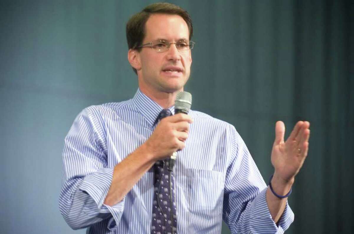 In this Sept. 2, 2009, file photo, U.S. Rep. Jim Himes, D-Conn., speaks during a health care reform town hall meeting at Norwalk High School.