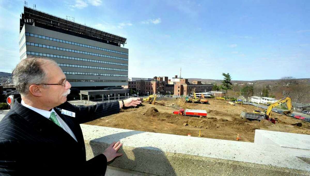 Morris Gross, vice president of Western Connecticut Healthcare, points out construction of the new Tower expansion project from the Hospital Avenue parking garage at Danbury Hospital, Friday, April 15, 2011.