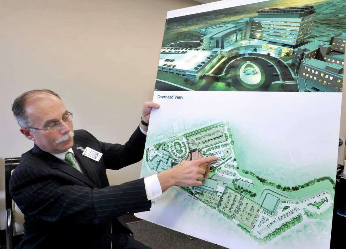 Morris Gross, vice president of Western Connecticut Healthcare, points out construction plans of the new Tower expansion project at Danbury Hospital, Friday, April 15, 2011.